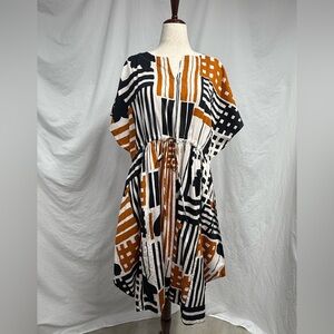 Chic Geometric Dress in Black, White, and Orange